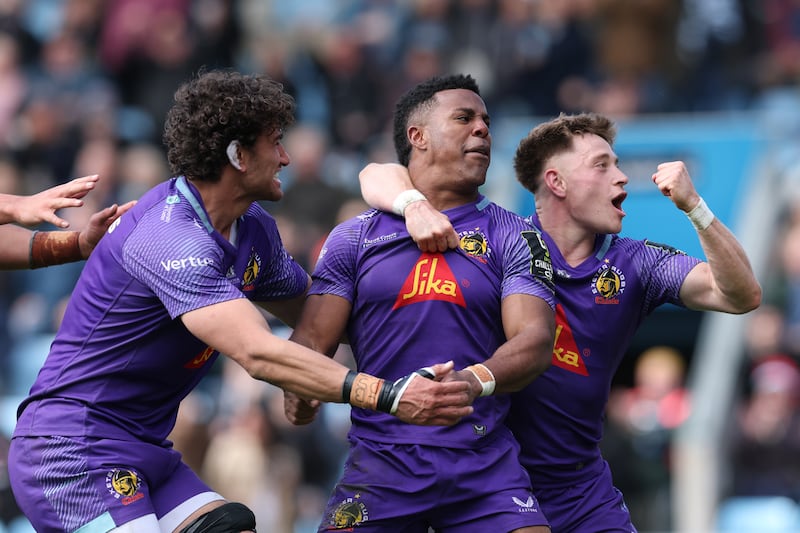 Immanuel Feyi-Waboso celebrates scoring Exeter Chiefs' fourth try with team-mates Andrea Zambonin and Stephen Varney. Photograph:  Michael Steele/Getty Images