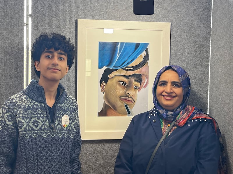 Abdul Ahad Zulfiqar, pictured with his mother Tasleem, and his self-portrait entitled Study. Photograph: Tim O'Brien