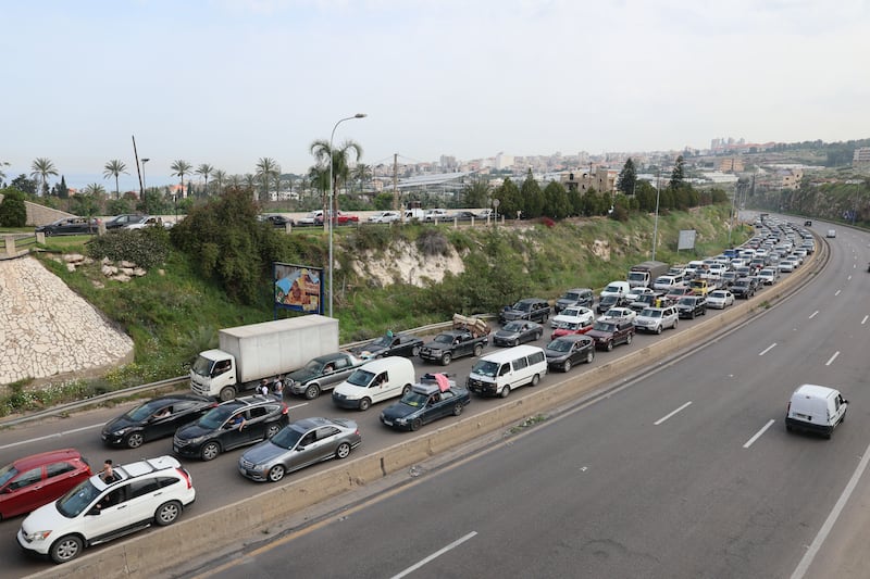 Vehicles line the road towards southern Beirut as displaced residents return to their homes in Lebanon on Friday. Photograph: Wael Hamzeh/EPA