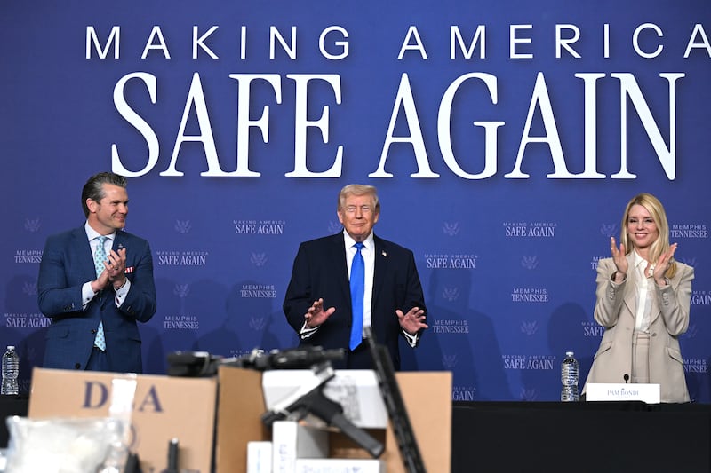 Bondi (right) with Trump and US defence secretary Pete Hegseth at an event in Mempis, Tennessee, in March. Photograph: Roberto Schmidt/Getty