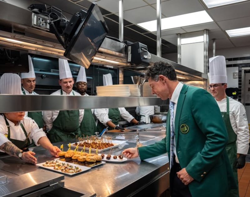 Rory McIlroy tastes some of his dishes in the kitchen ahead of the champions' dinner at Augusta. Photograph: The Masters/X