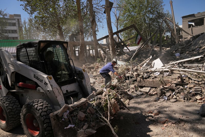 Workers remove debris at Tehran’s Sharif University of Technology complex, which Iranian authorities say was hit on Monday by a US-Israeli strike. Photograph: Francisco Seco/AP