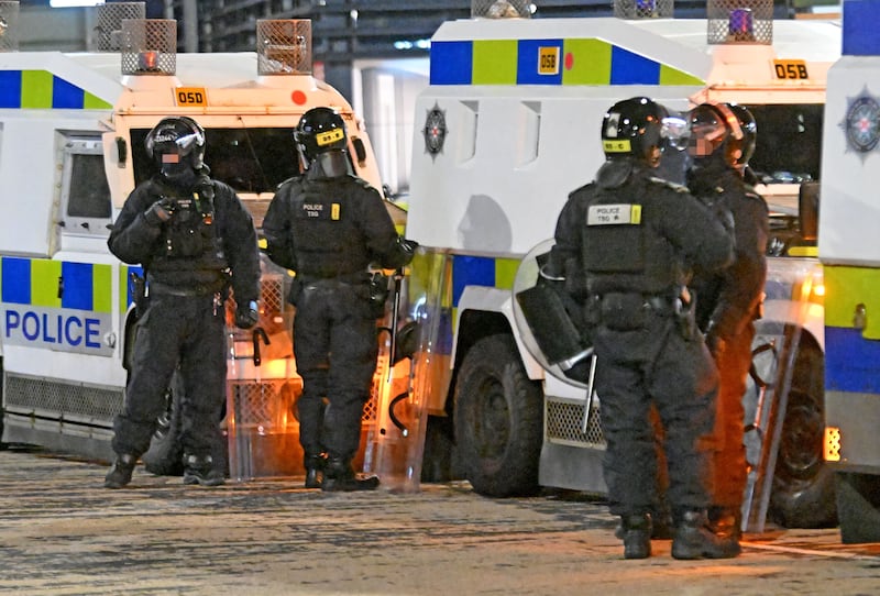 Cliftonville fan stones police lines at Broadway near Windsor Park after his team's defeat on penalties to Dungannon in the Irish Cup semi-final tonight.