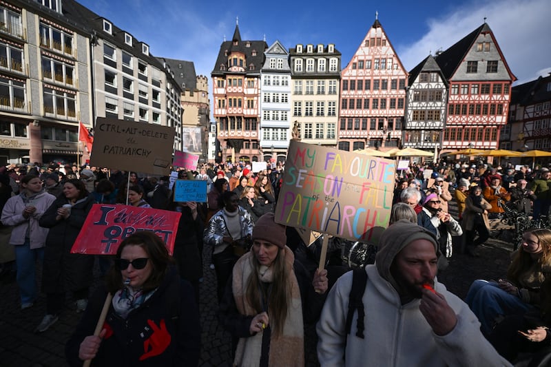 Participants in a rally against digital violence demonstrate with placards at Frankfurt's central Roemer Square. Photograph: Kirill Kudryavtsev/AFP/Getty