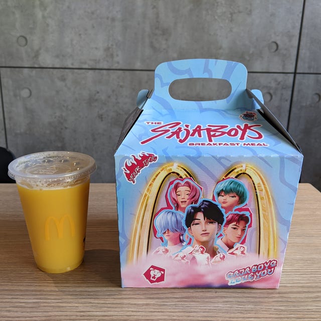 Breakfast meal box and drink on a table