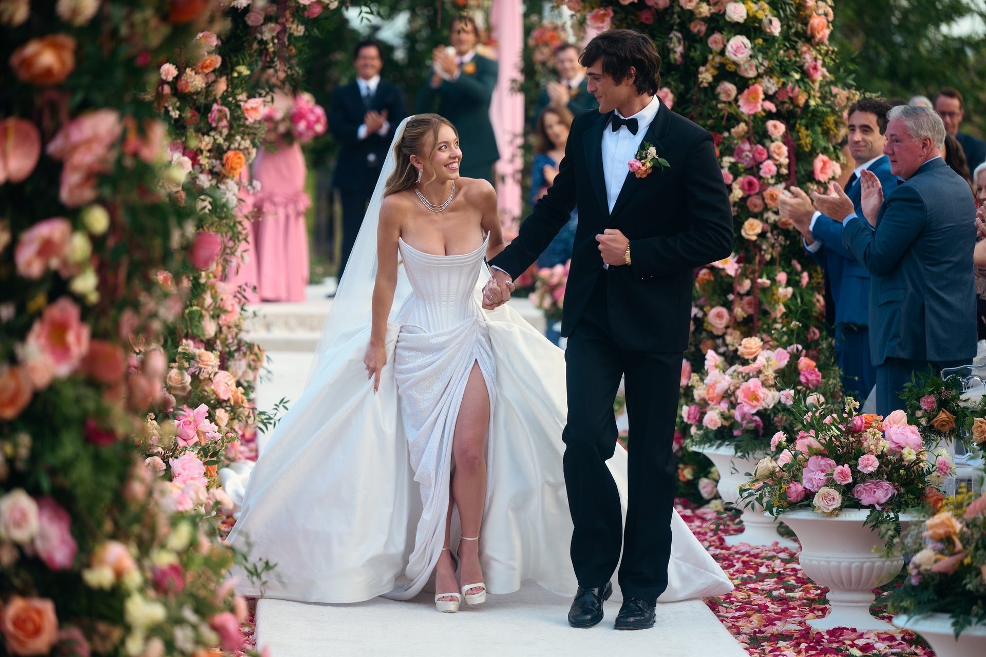 Wedding ceremony with couple walking down the aisle.