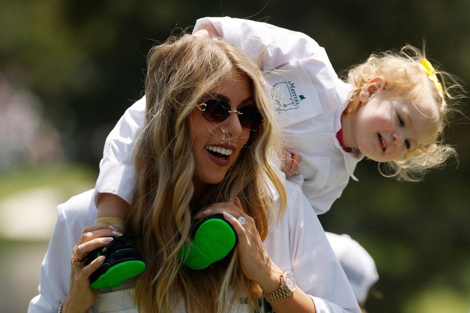 Golf - The Masters - Augusta National Golf Club, Augusta, Georgia, U.S. - April 8, 2026
Wife of Spain's Jon Rahm, Kelley Cahill with their daughter Alaia Rahm during the par 3 contest REUTERS/Brian Snyder