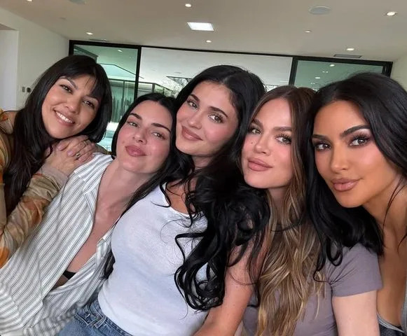The Kardashian and Jenner sisters posing together in a rare photo.Credit: Kim Kardashian/Instagram