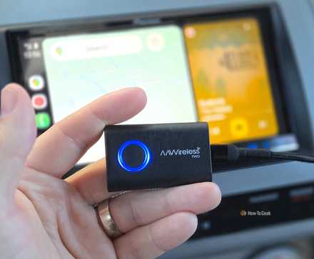 Person holding an AAWireless TWO in a car.