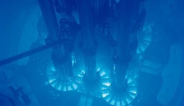 The Advanced Test Reactor at Idaho National Laboratory, glowing blue with Cherenkov radiation. Argonne National Laboratory. CC BY-SA 2.0, via Wikimedia Commons.