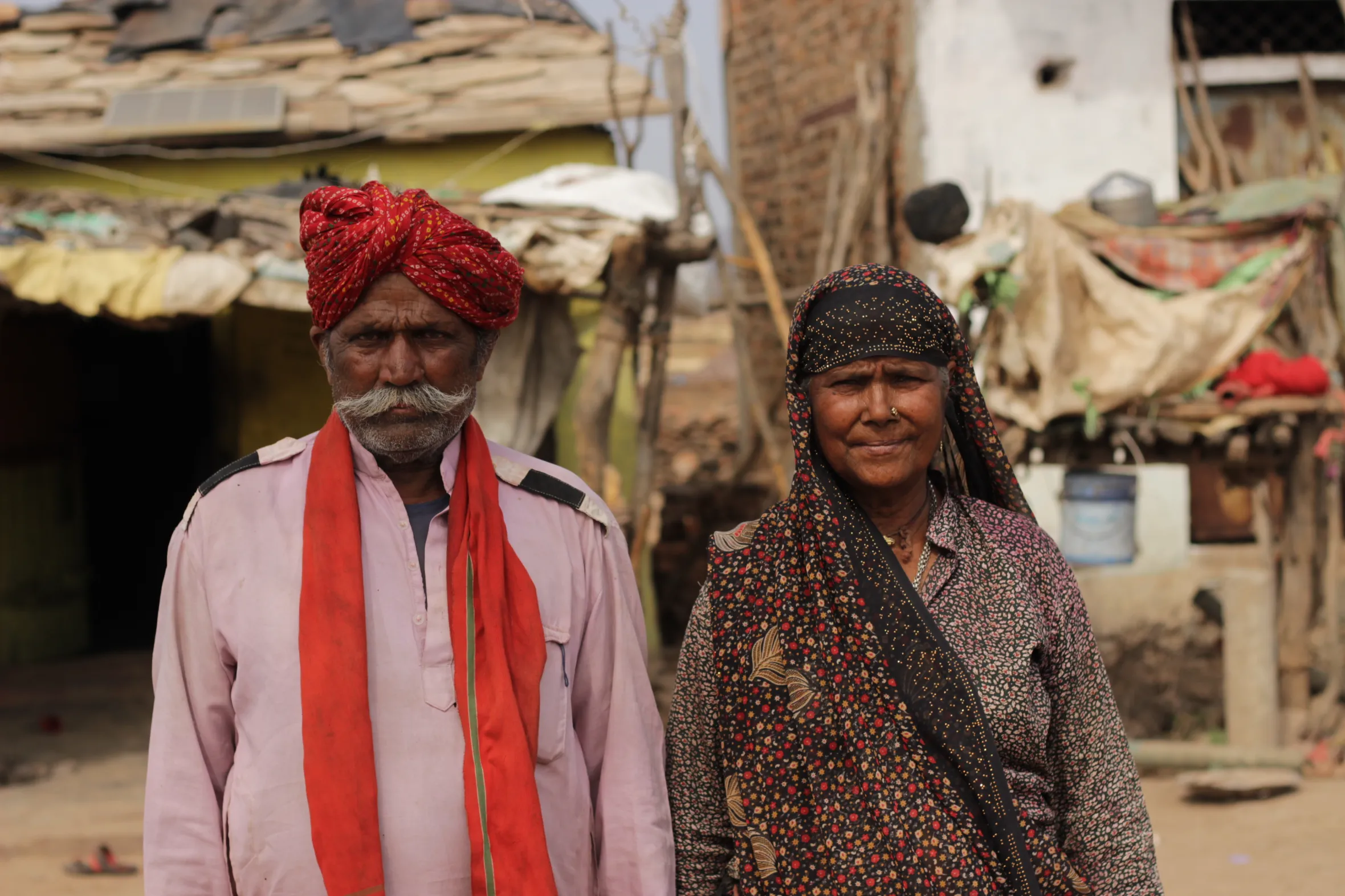 Hira Lal and his wife outside their makeshift dwelling in the Kuno National Park buffer area.