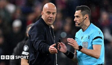 Liverpool manager Arne Slot speaks to referee Maurizio Mariani during the Champions League quarter-final second leg against Paris St-Germain