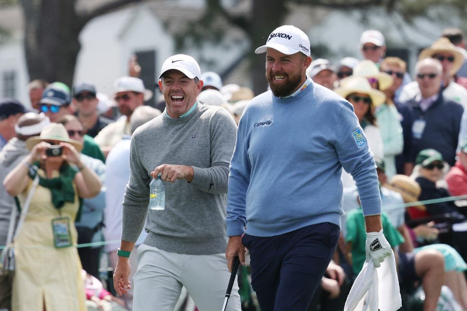 Golf - The Masters - Augusta National Golf Club, Augusta, Georgia, U.S. - April 8, 2026
Northern Ireland's Rory McIlroy with Ireland's Shane Lowry on the 1st hole during the par 3 contest REUTERS/Mike Segar
