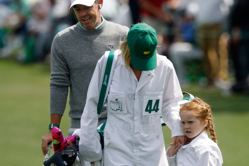 Golf - The Masters - Augusta National Golf Club, Augusta, Georgia, U.S. - April 8, 2026
Northern Ireland's Rory McIlroy with Ireland's Shane Lowry's wife Wendy Lowry and daughter Ivy Lowry on the green of the 2nd hole during the par 3 contest