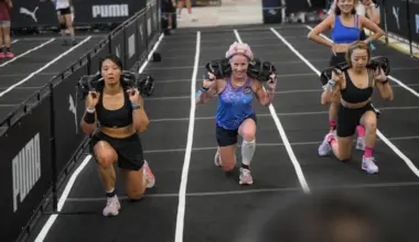 Carolyn Soemarjono (centre), a cancer survivor in her 60s, doing sandbag lunges during the Hyrox Singapore race held at the National Stadium on April 5, 2026.