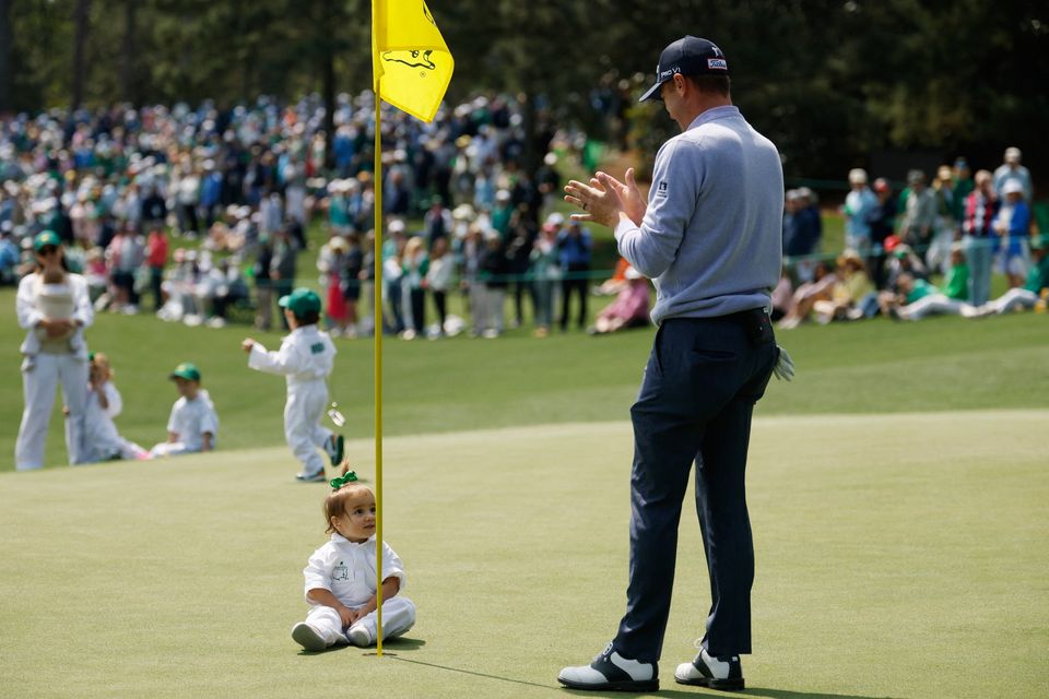 Golf - The Masters - Augusta National Golf Club, Augusta, Georgia, U.S. - April 8, 2026
Justin Thomas of the U.S. with his daughter Molly Thomas on the green of the 2nd hole during the par 3 contest REUTERS/Brian Snyder