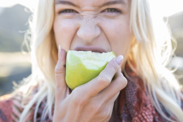 Woman eating an apple Woman eating an apple