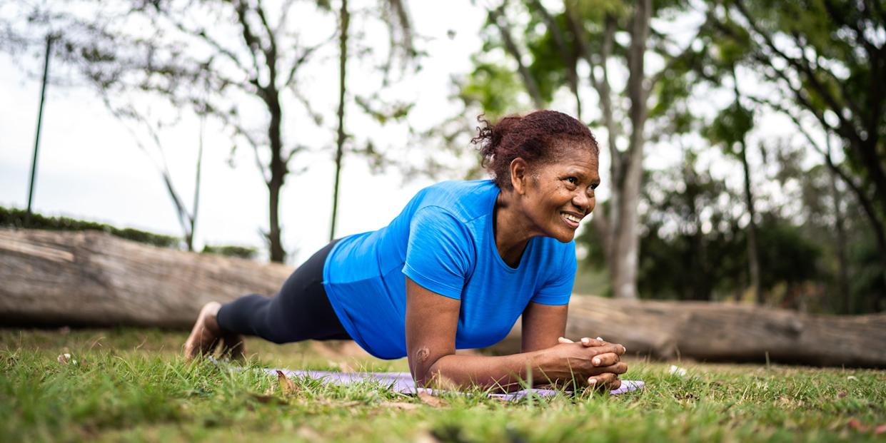 Senior woman exercising in a park