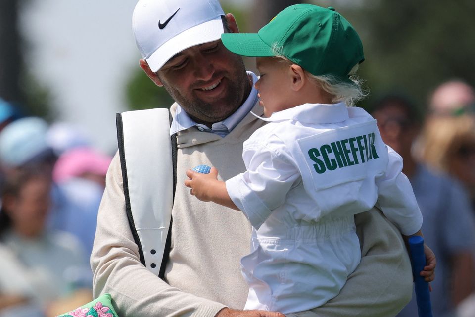 Golf - The Masters - Augusta National Golf Club, Augusta, Georgia, U.S. - April 8, 2026
Scottie Scheffler of the U.S. with his son Bennett Scheffler during the par 3 contest REUTERS/Mike Segar