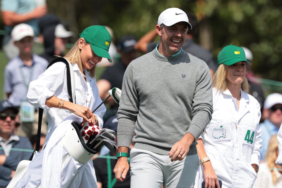 Golf - The Masters - Augusta National Golf Club, Augusta, Georgia, U.S. - April 8, 2026
Northern Ireland's Rory McIlroy reacts with his wife Erica Stoll on the 3rd hole during the par 3 contest REUTERS/Kylie Cooper