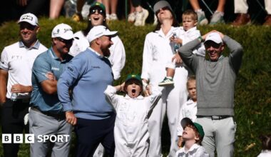Shane Lowry, Rory McIlroy and their families react to Frankie Fleetwood hitting his ball in the water on the ninth hole of Augusta National's par three course