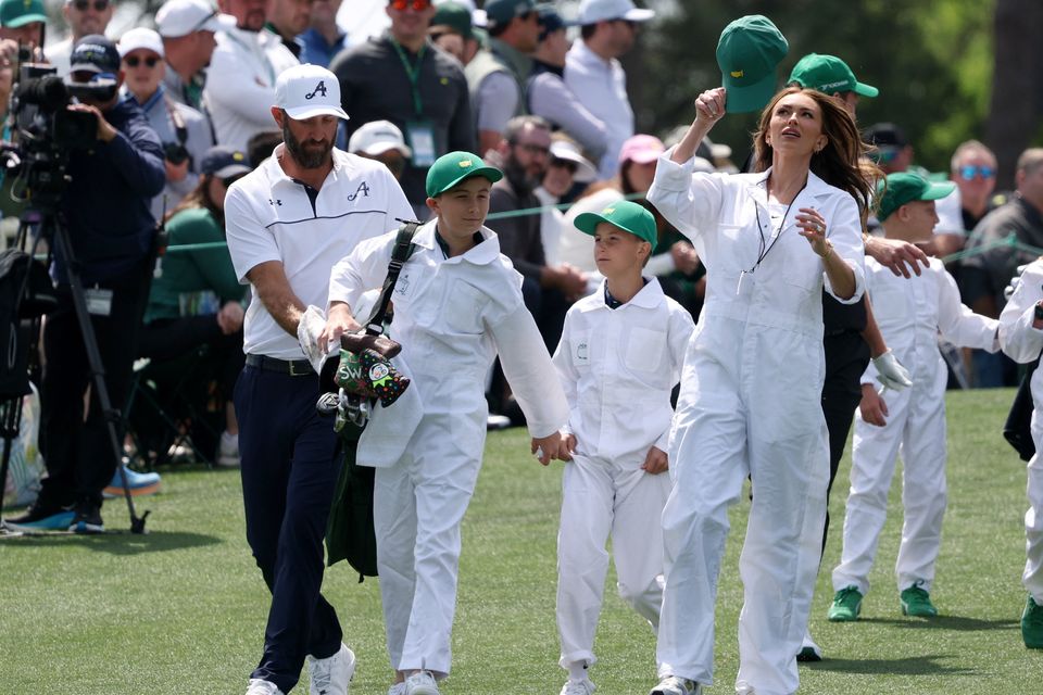 Golf - The Masters - Augusta National Golf Club, Augusta, Georgia, U.S. - April 8, 2026
Dustin Johnson of the U.S. with his wife Paulina Gretzky and their sons Tatum Johnson and River Johnson during the par 3 contest REUTERS/Mike Segar