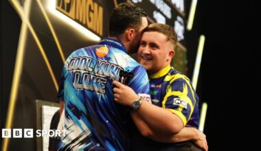 Luke Littler (right) embraces Luke Humphries after victory in the final on night thirteen of the BetMGM Premier League 2026 at P&J Live, Aberdeen.