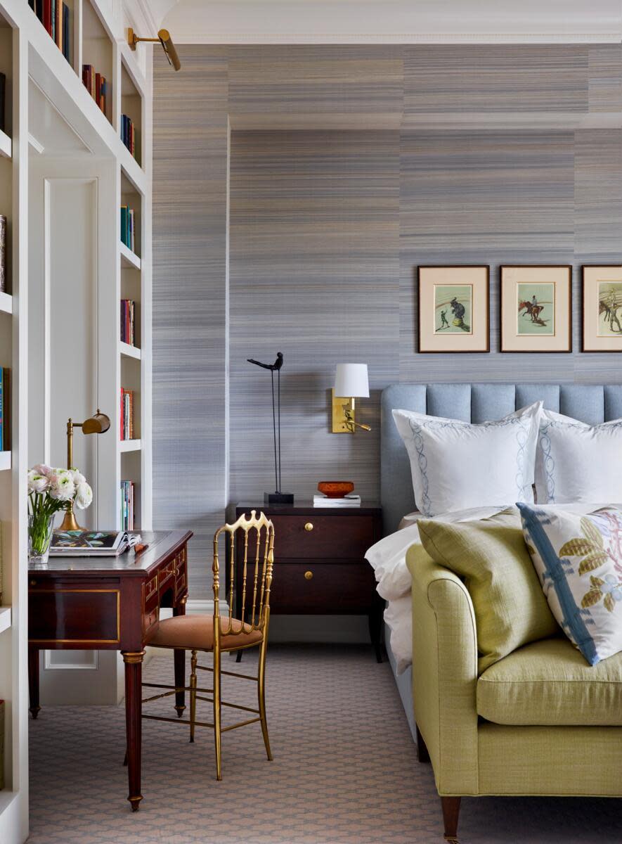 Cozy bedroom with a desk and bookshelves