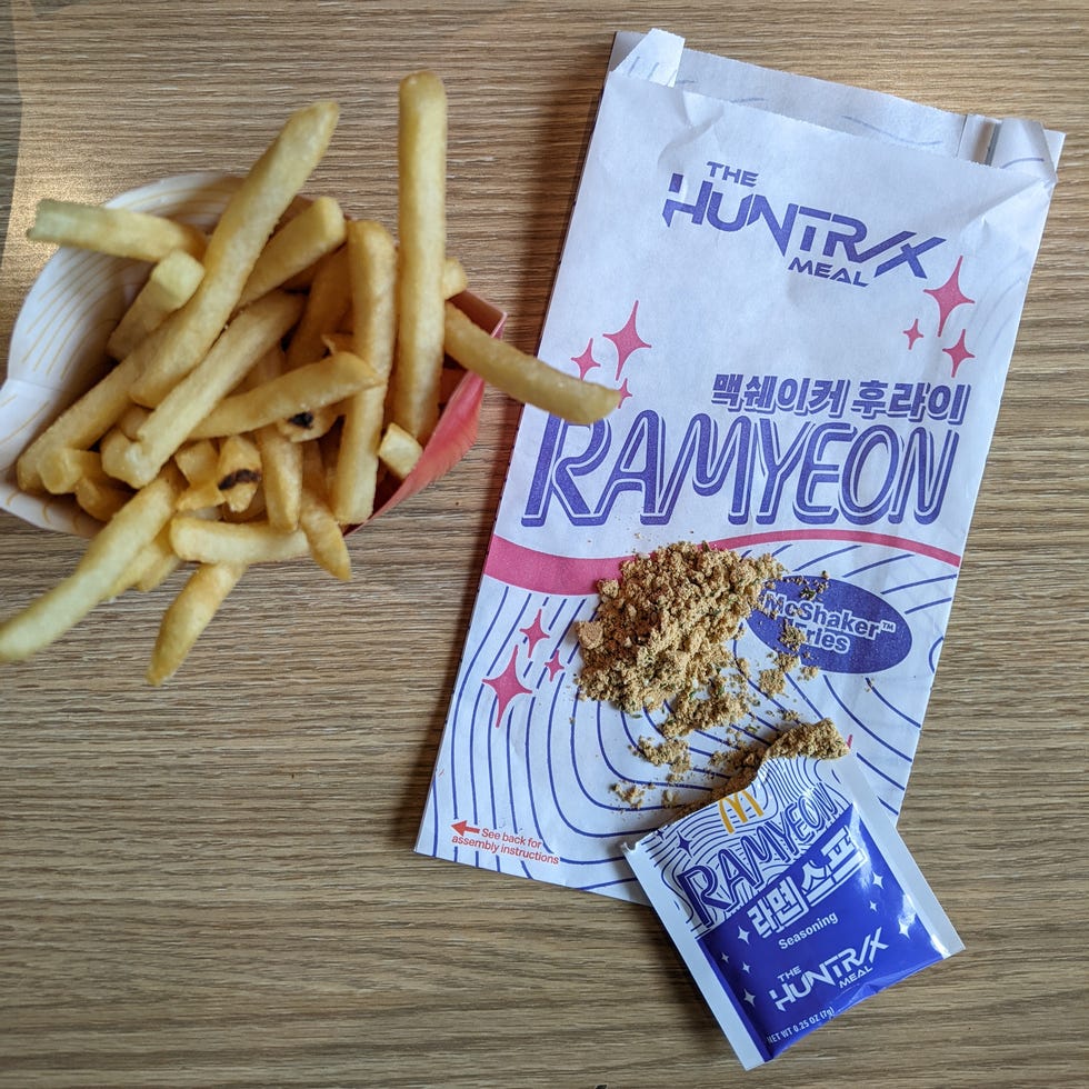 Fast food meal featuring fries and a unique seasoning mix. Fast food meal featuring fries and a unique seasoning mix.