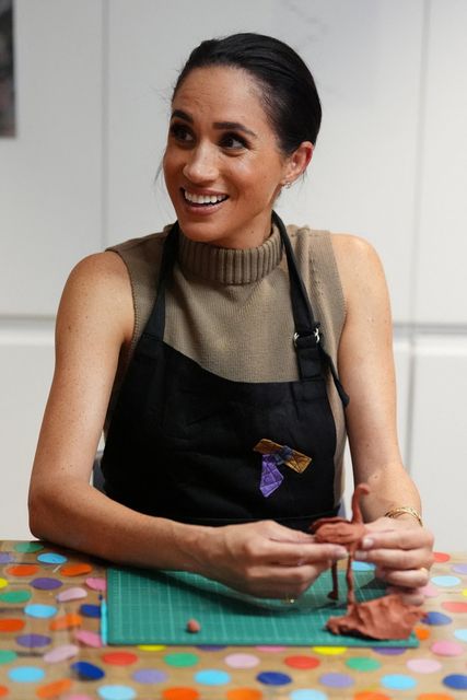 Meghan, the Duchess of Sussex, takes part in a model-making activity with veterans and their families at the Australian National Veterans Arts Museum (ANVAM) in Southbank, Melbourne, Australia, April 14, 2026. Jonathan Brady/Pool via REUTERS