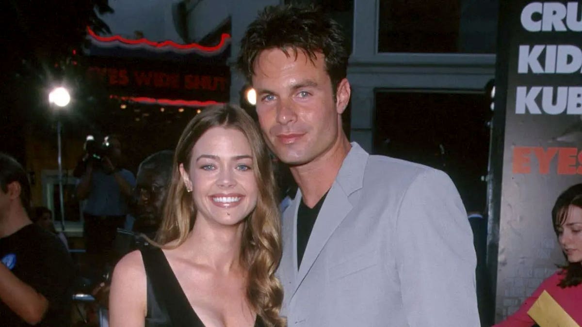 Denise Richards and Patrick Muldoon smile as they pose together
