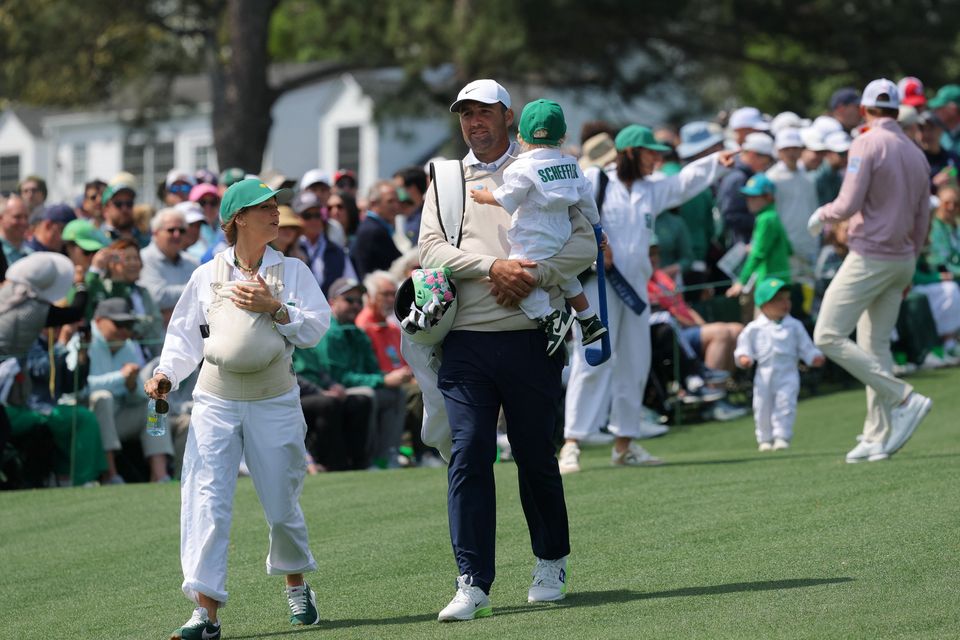 Golf - The Masters - Augusta National Golf Club, Augusta, Georgia, U.S. - April 8, 2026
Scottie Scheffler of the U.S. with his wife Meredith Scheffler and sons Bennett Scheffler and Remy Scheffler during the par 3 contest REUTERS/Mike Segar