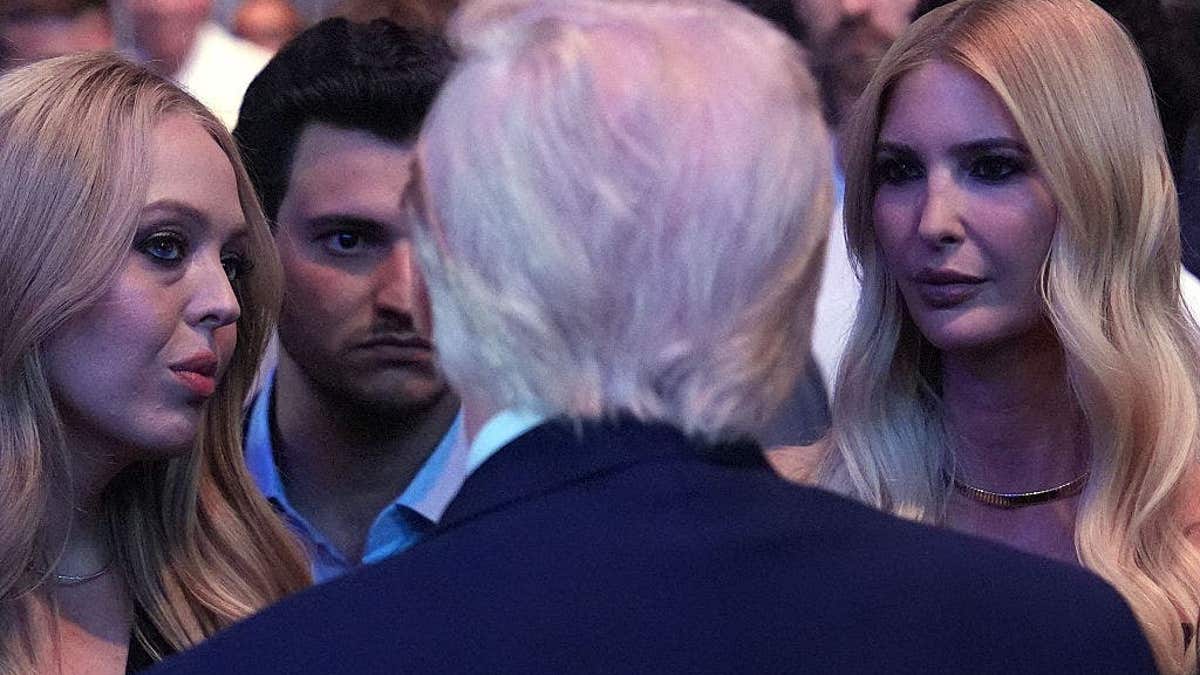 US President Donald Trump speaking with Tiffany Trump, Michael Boulos, and Ivanka Trump at UFC event