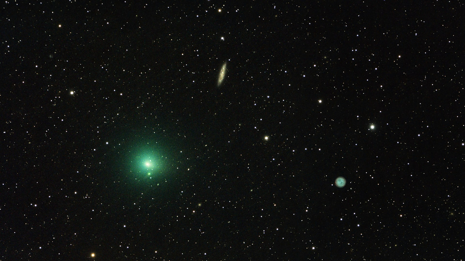 A photo of a green comet in a starry sky