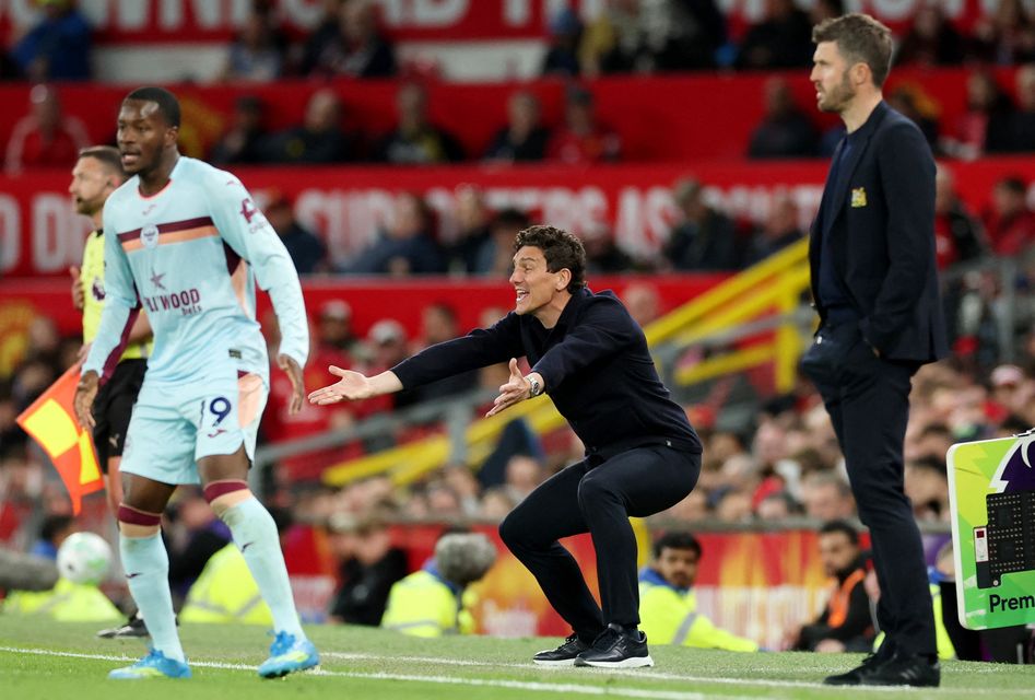 Brentford manager Keith Andrews and Manchester United manager Michael Carrick at Old Trafford. (REUTERS/Phil Noble)