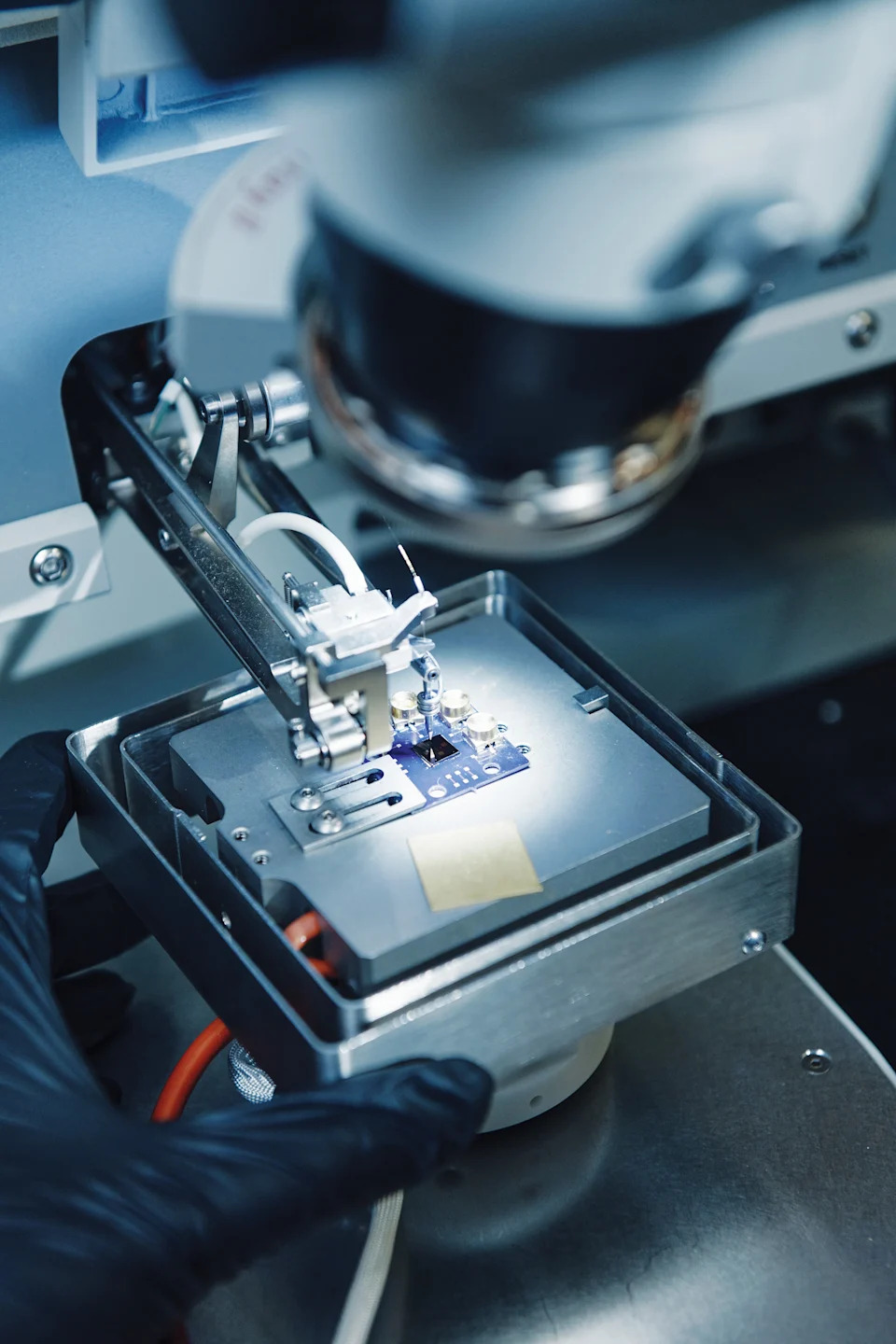A close up of wires bonding to a chip.