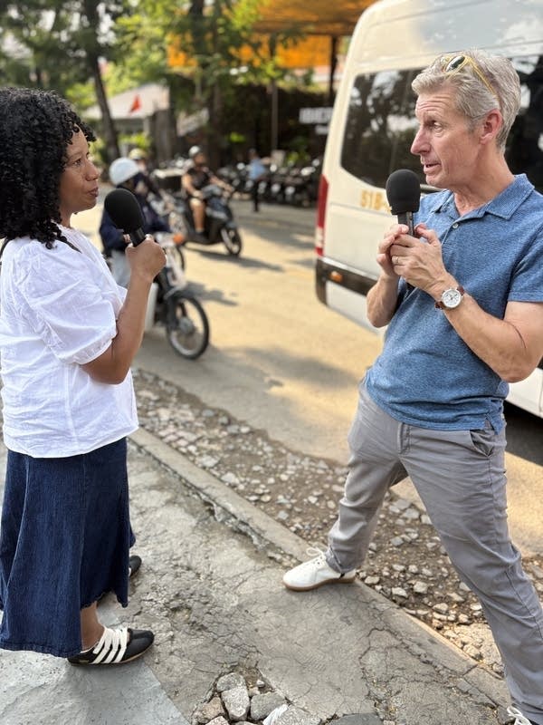 Marketplace’s Kai Ryssdal and ADP’s Nela Richardson in Ho Chi Minh City’s Thao Dien neighborhood, which has become popular with expats.
