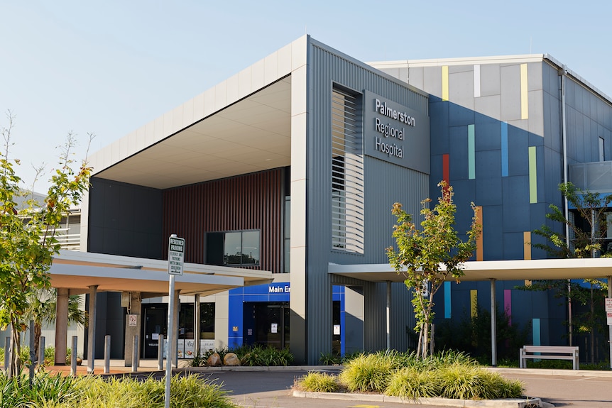 The exterior of a large multi-coloured building, with the words: Palmerston Regional Hospital.