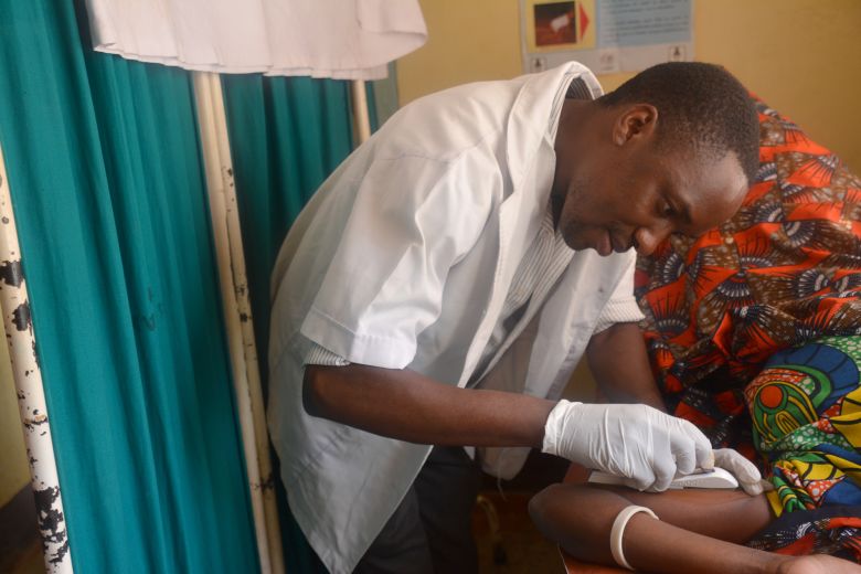 A doctor in Tanzania inserts a birth control implant into a patient's arm in an image provided by EngenderHealth, an organization working to advance reproductive health in Africa and Asia.