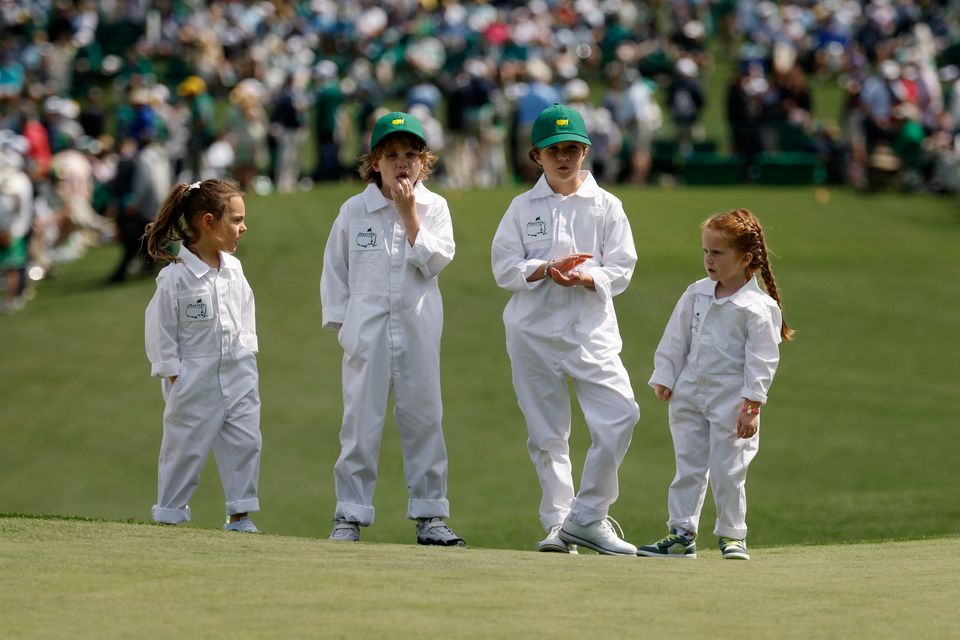 Poppy McIlroy, Frankie Fleetwood, Iris Lowry and Ivy Lowry on the second hole during the Masters par 3 contest at Augusta National Golf Club, Augusta, Georgia. Photo: Reuters/Brian Snyder