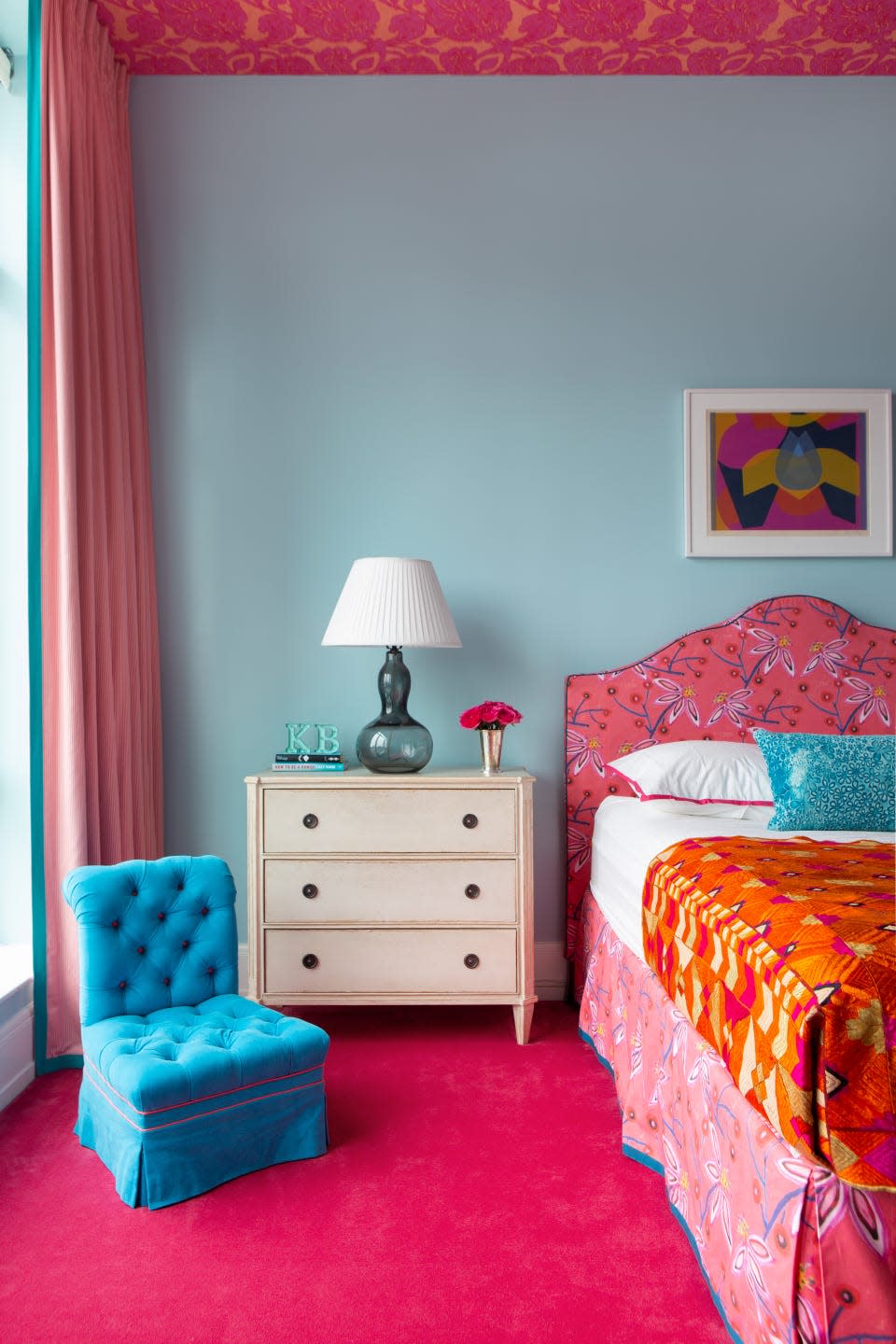 Colorful bedroom with vibrant decor and furniture.