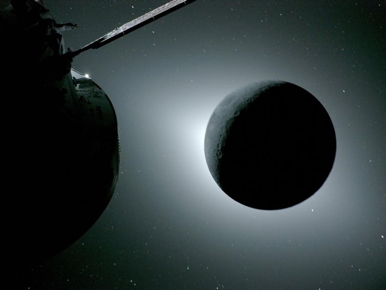 A spacecraft flying beside a circular moon backlit by the sun.