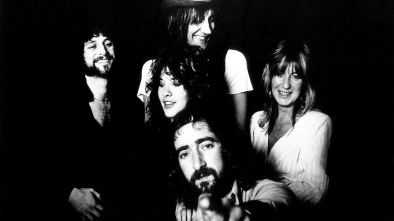 Fleetwood Mac smiling and posing together in the late 1970s