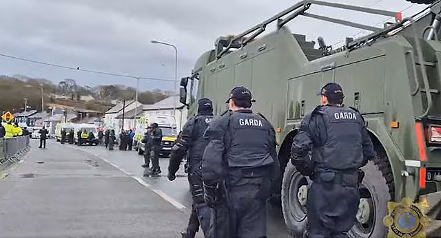 Garda officers on a road