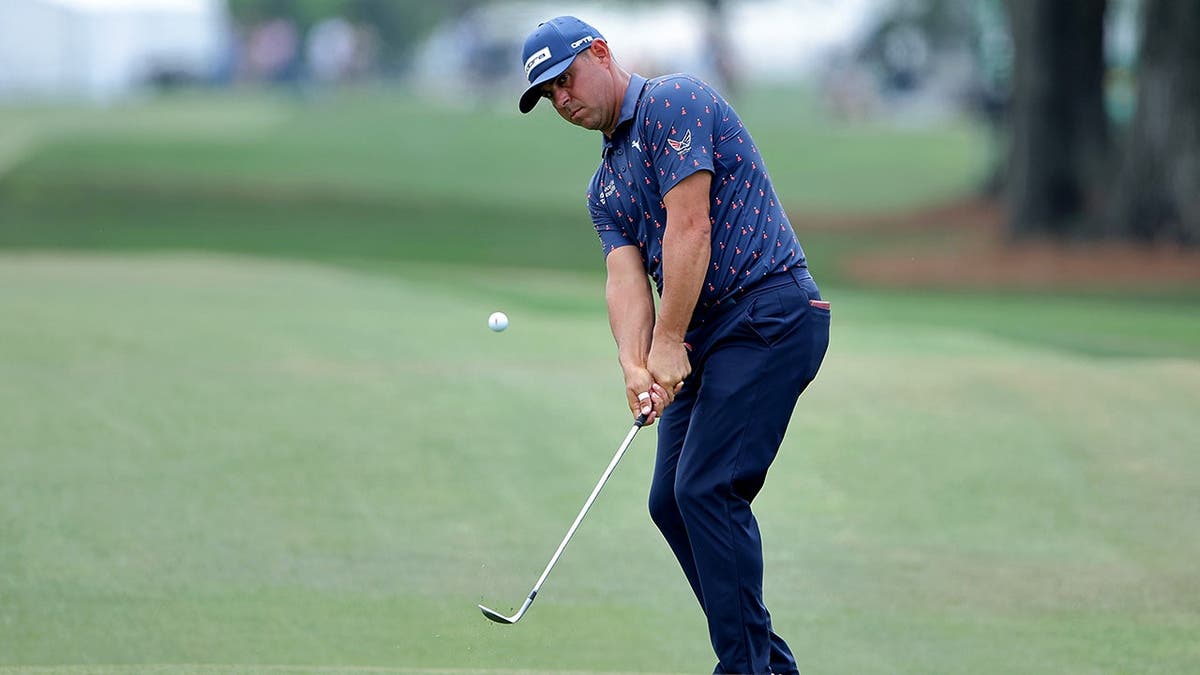 Gary Woodland chipping onto the green on the eighth hole at Houston Open golf tournament