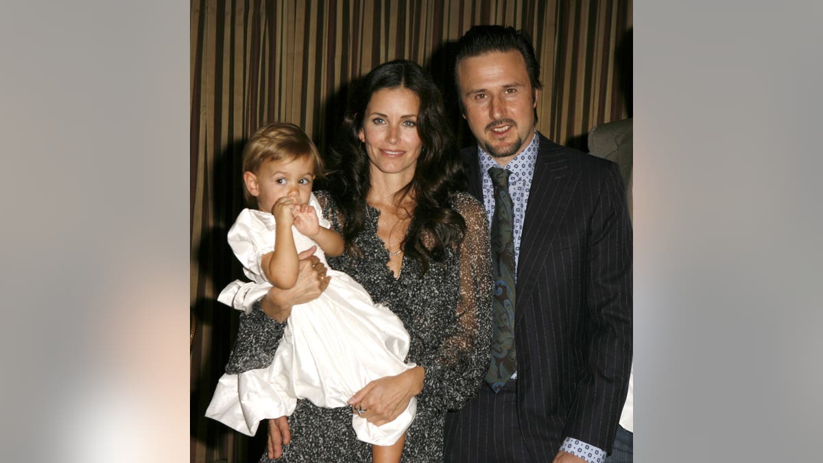 Coco Arquette Courteney Cox Arquette and David Arquette posing together at an event