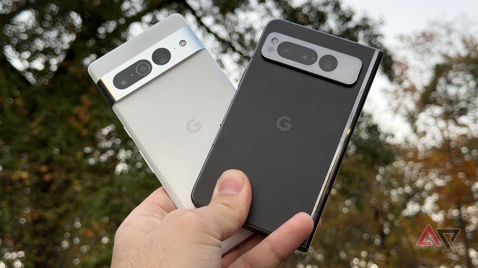 Google Pixel Fold and Pixel 7 Pro held up at dusk