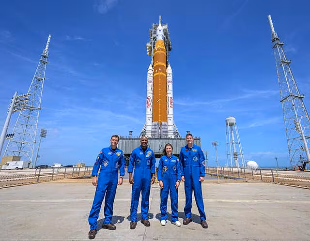 The crew with outside the rocket before lift-off