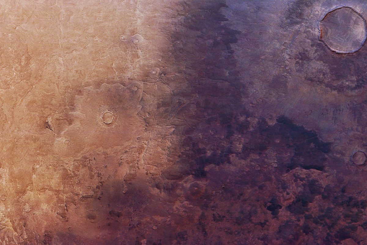 Section of an image showing a blanket of dark ash creeping across the surface of Mars in the Utopia Planita region, as seen by the Mars Express probe. Credit: ESA/DLR/FU Berlin