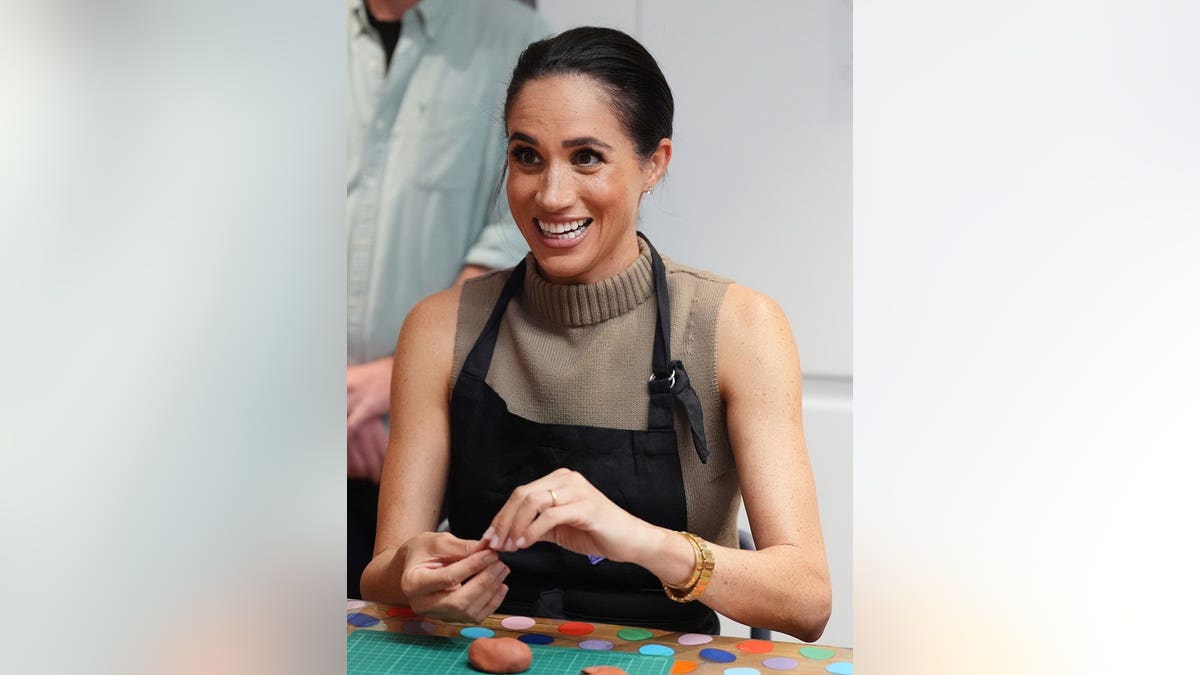 Meghan, Duchess of Sussex, participating in model making activity with veterans and families